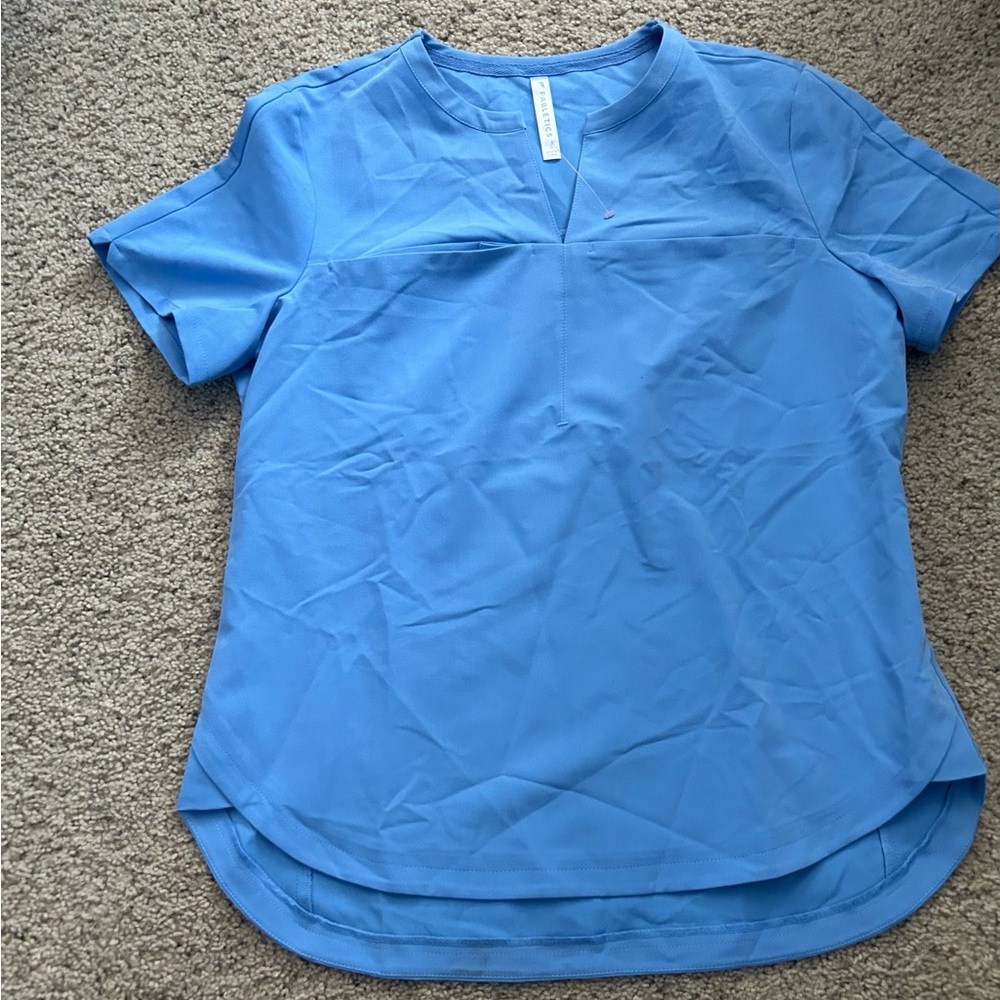 Brand new fabrics women’s light blue scrub/top size small